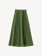 Green pleated skirt on a light background