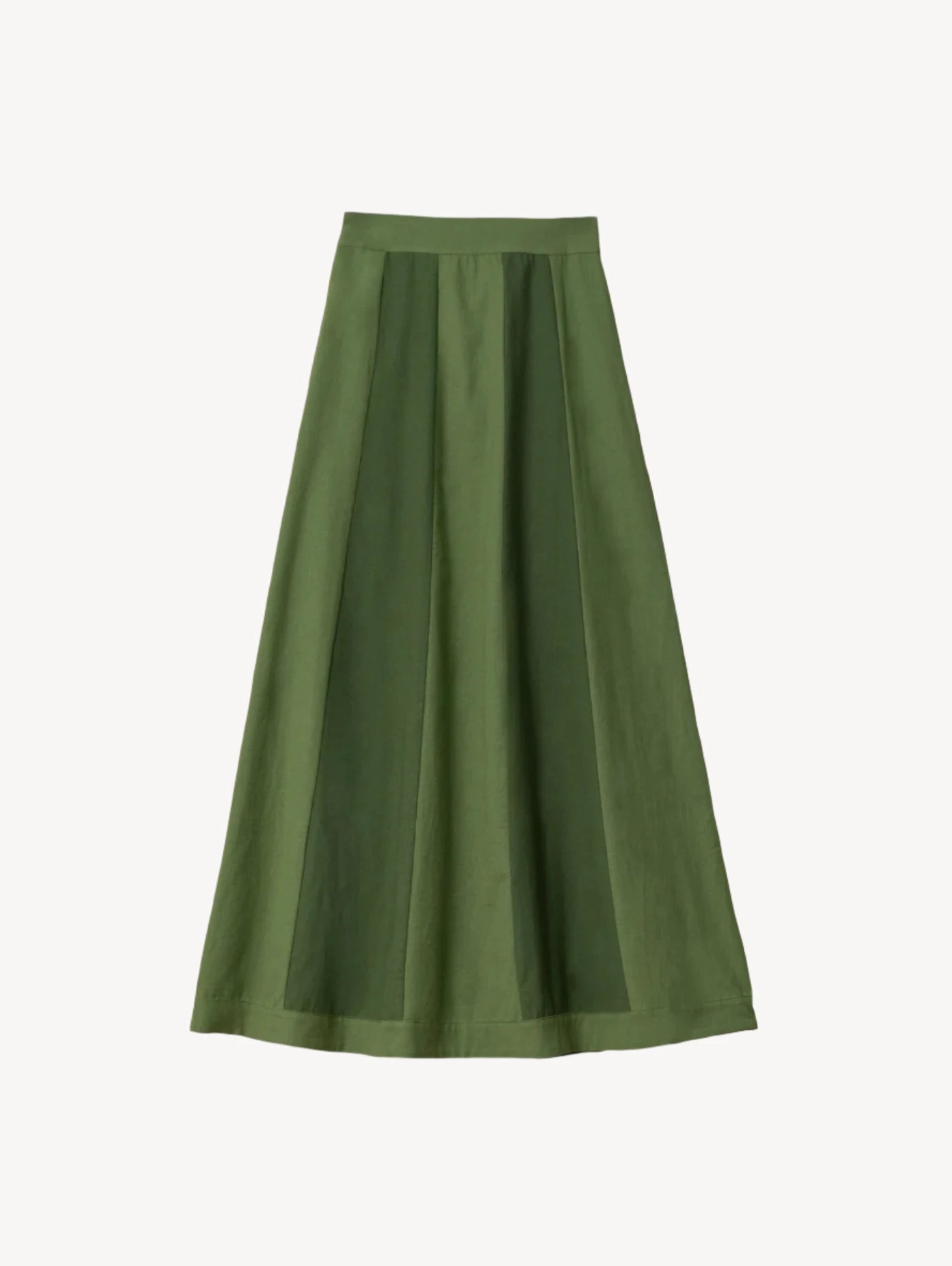 Green pleated skirt on a light background