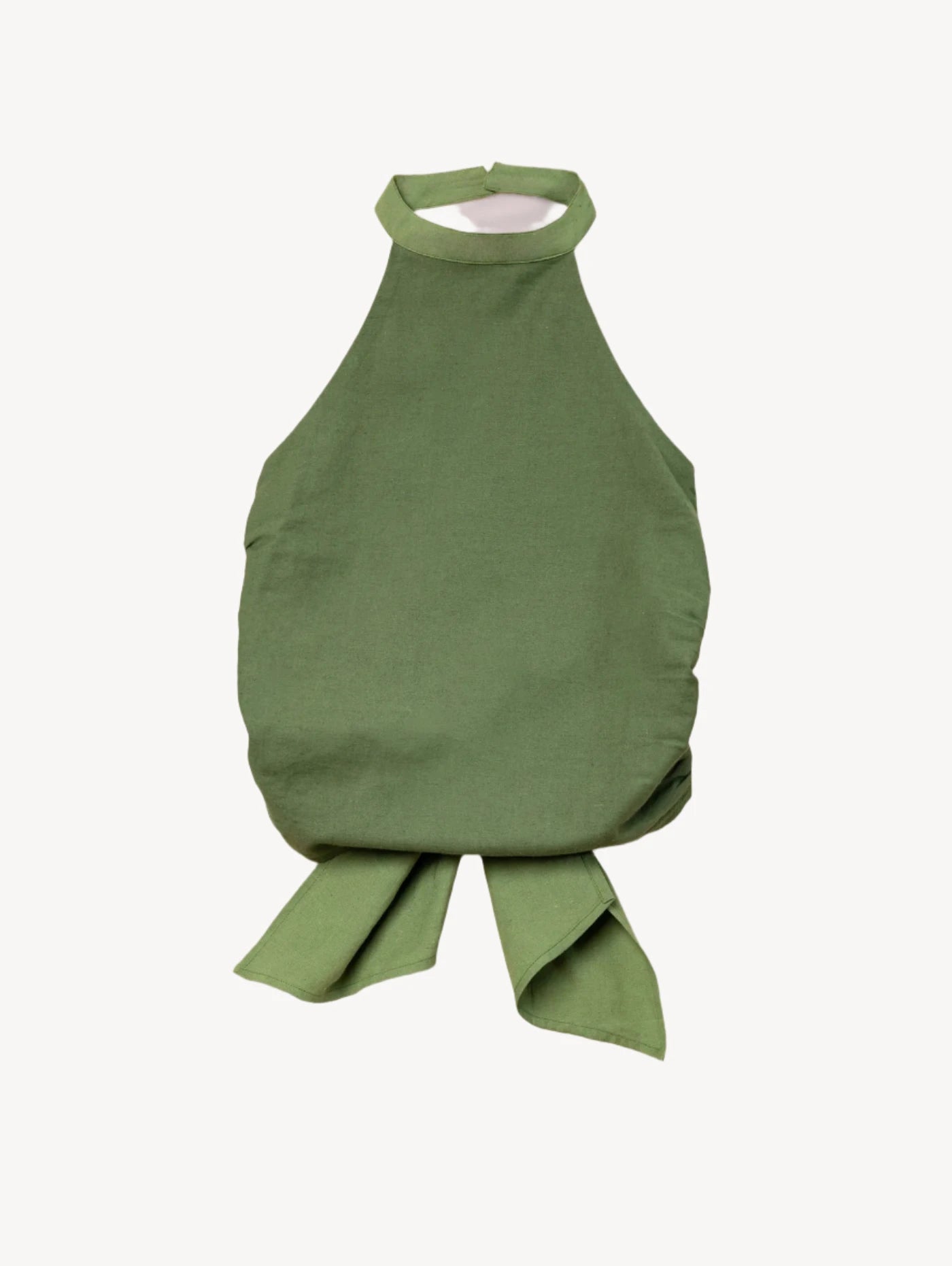 Green halter top with a knot detail on a light beige background